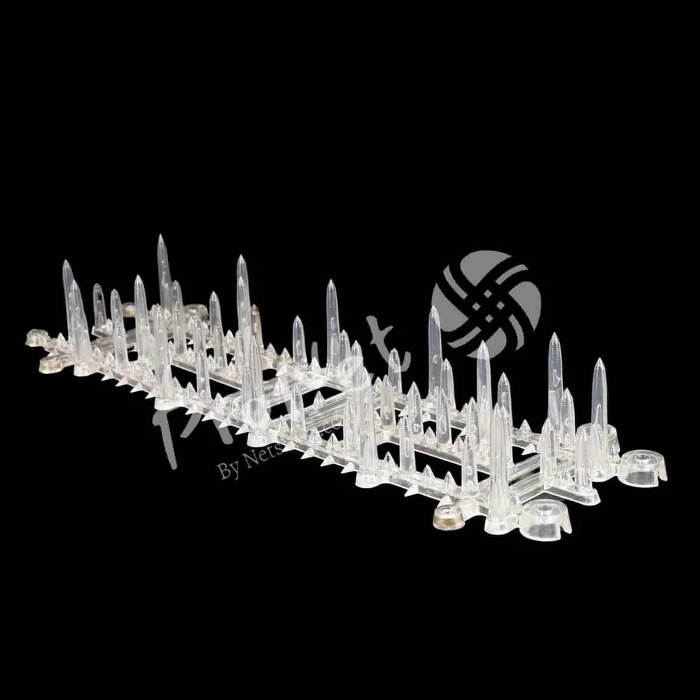 Angled view of ProNet polycarbonate monkey spikes for reducing monkey movement on ledges and parapet edges
