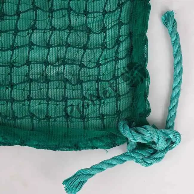 Close-up view of ProNet construction safety net showing green HDPE mesh and reinforced border rope
